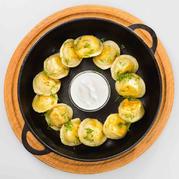 Dumplings with juicy chicken baked with cheese