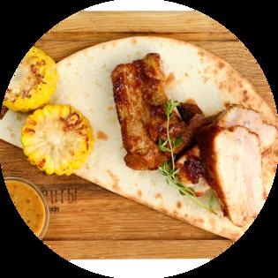 Pork ribs with honey mustard sauce and grilled corn